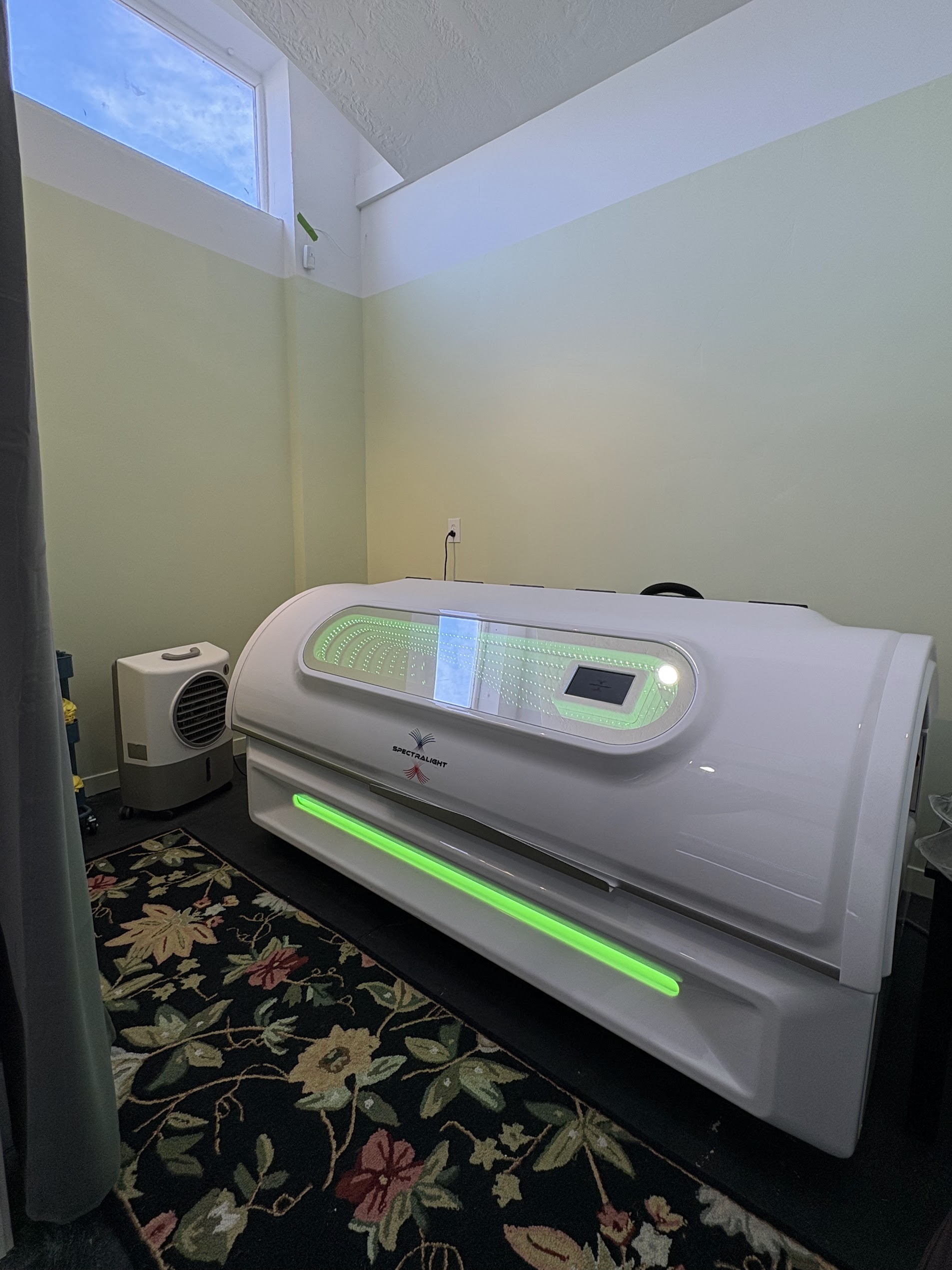 IllumaForge photobiomodulation bed in the session room at EVERFORGED Wellness Center Sandy